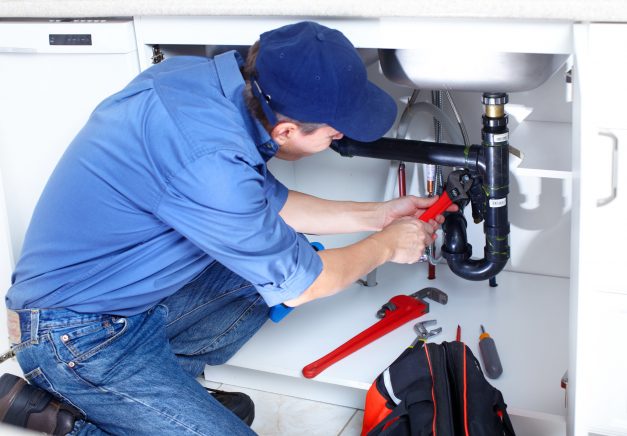 plumber repairing sink